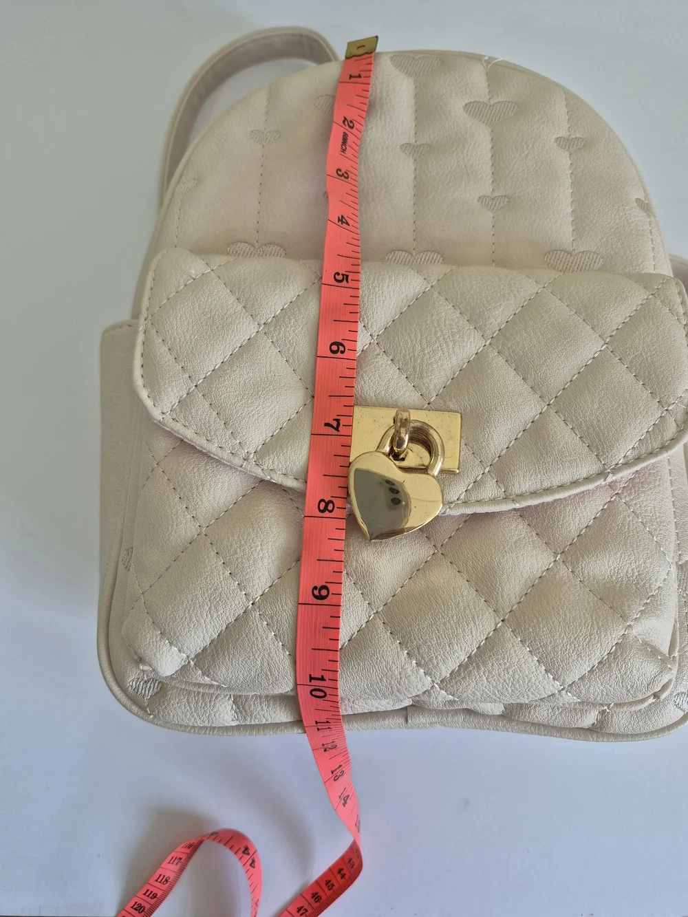 Under One Sky Cream Quilted Backpack with Gold Heart Lock